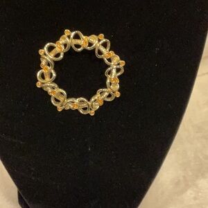 MARVELLA Gold tone Brooch with topaz rhinestones